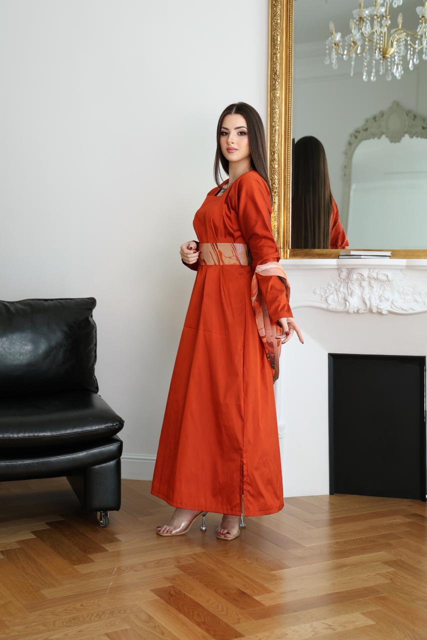 Woman in an orange dress standing in a room with a mirror and black leather 

Orange abaya, abaya set, three-piece abaya, abaya with belt, Hezam abaya, luxury abaya, designer abaya, modest fashion, Dubai abayasofa.